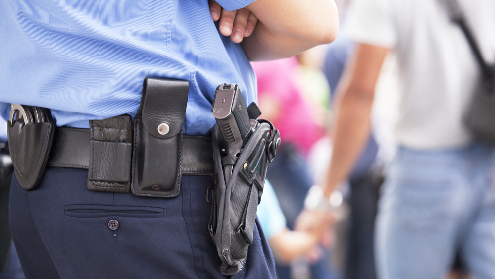 police officer workbelt with gun attached to hip-law offices of ed singer